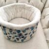 Luxury cuddle cup pet bed with cat resting in a soft cozy nest